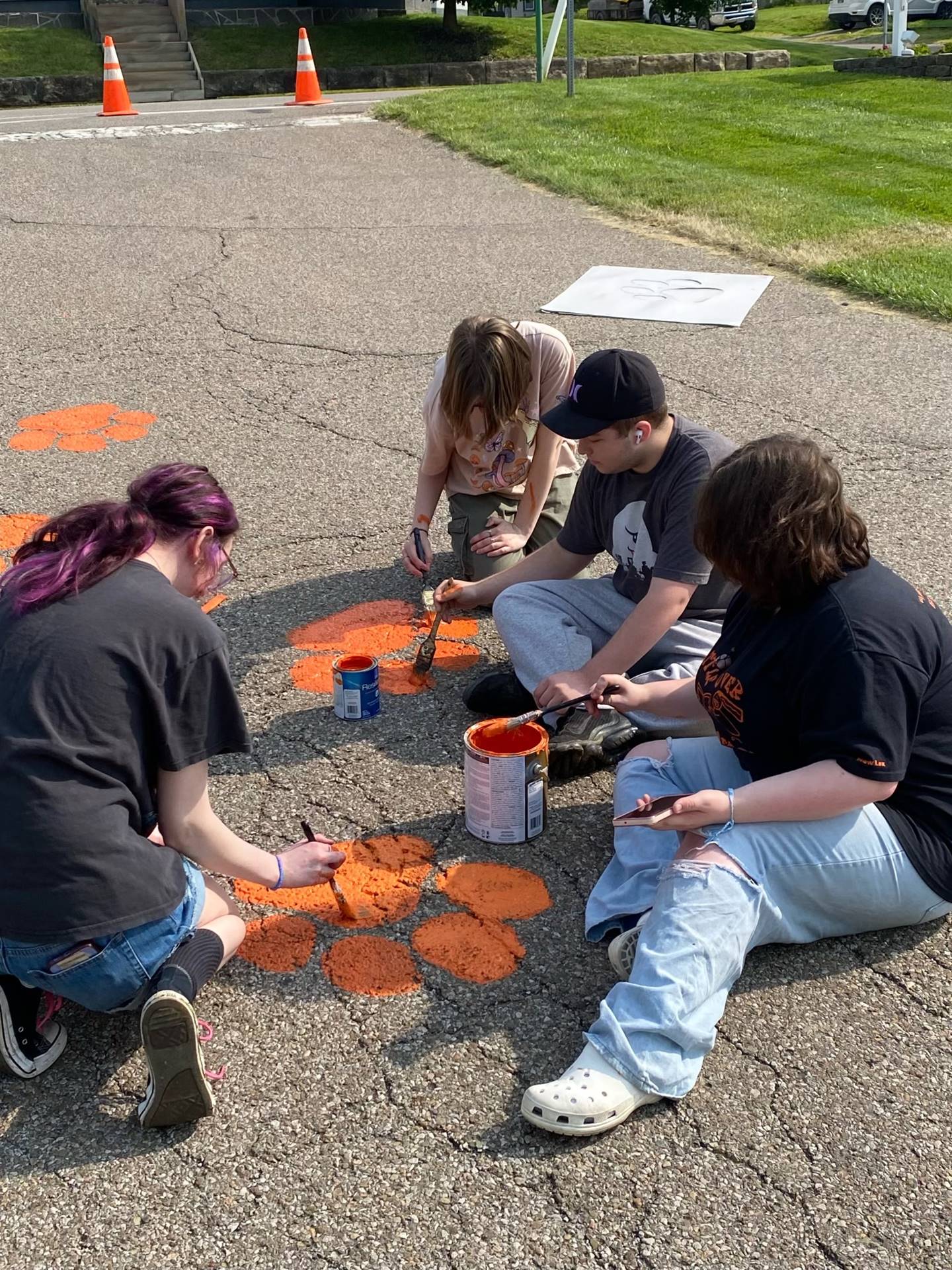 Painting Panther Paws on Stadium Drive